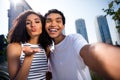 Photo of flirty excited wife husband wear casual clothes tacking selfie sending you kiss outside urban city street Royalty Free Stock Photo