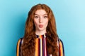 Photo of flirty ginger hairdo young lady blow kiss wear colorful shirt on blue color background