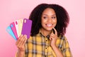 Photo of flirty playful smart lady hold fan phone case look side wear checkered shirt isolated pink color background