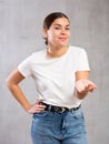 Photo of flirty young woman standing posing intriguingly
