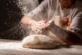 Photo of flour and women hands with flour splash. Cooking bread. Kneading the Dough. Isolated on dark background. Empty space for Royalty Free Stock Photo