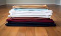Photo of folded clothes on a wooden floor Royalty Free Stock Photo