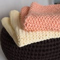 Folded knitted blankets in the basket