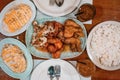 Photo of a food buffet of chicken wings with various flavors, cheesy pasta carbonara with rice, iced tea for commercial purposes Royalty Free Stock Photo