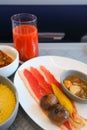 Photo of Food served on board of business class airplane on the table Royalty Free Stock Photo