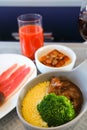 Photo of Food served on board of business class airplane on the table Royalty Free Stock Photo