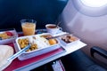 photo of Food served on board of economy class airplane on the table Royalty Free Stock Photo