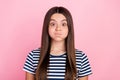Photo of fooling funky girl dressed striped clothes big eyes bloated cheeks isolated pink color background