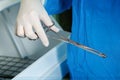 Photo forceps in the hands of doctor in latex gloves