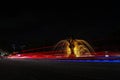photo light trail blue and yellow lamp fountain and fish statue city