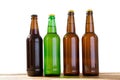 Photo of four different full beer bottles with no labels. Separate clipping path for each bottle included. Four 4 separate photos Royalty Free Stock Photo