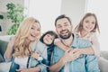 Photo of four family members after adoption having best time rejoicing sit couch living room indoors