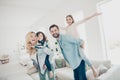 Photo of four family members having best free time pretend funny flight airplane indoors apartments