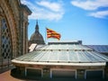 Photo of fragment Dome and official flag of Catalonia on the roof of Famous National Art Museum in Barcelona,Spain
