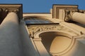 Urban landscape. Photo of a fragment of the facade of a historic building with elements of classical architecture. Royalty Free Stock Photo