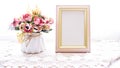 Photo frame with artificial flower pink rose on white background Royalty Free Stock Photo