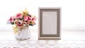 Photo frame with artificial flower pink rose on white background Royalty Free Stock Photo