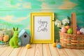 Photo frame or artwork display mock up on wooden table