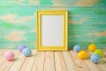 Photo frame or artwork display mock up on wooden table