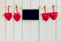 Photo frame blank and red heart hanging on white wood background Royalty Free Stock Photo