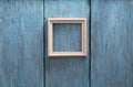 Photo frame on blue wooden wall Royalty Free Stock Photo