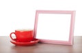Photo frame and coffee cup Royalty Free Stock Photo