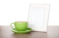 Photo frame and coffee cup Royalty Free Stock Photo