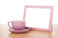 Photo frame and coffee cup Royalty Free Stock Photo