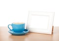 Photo frame and coffee cup Royalty Free Stock Photo