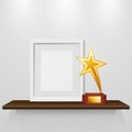 Photo Frame And Gold Star Award On The Shelf