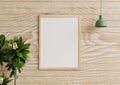 Photo frame mockup on a beautiful wooden wall in the living room With hanging lamps and flower pots on the side.3d rendering Royalty Free Stock Photo