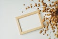 Photo frame mockup with blank paper card and dried flax on white background. Flat lay, top view, copy space Royalty Free Stock Photo