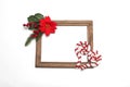 Photo frame surrounded by poinsettia flowers, canes and pinwheels as a Christmas prayer for a Christmas message