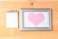 Photo frames, blank card and handmade hearts over wooden background Royalty Free Stock Photo