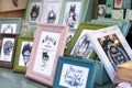 Photo frames on a Christams market fair with funny message about cat and home