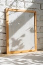 Photo frames on floor over white brick wall Royalty Free Stock Photo