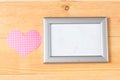 Photo frames and handmade hearts over wooden background Royalty Free Stock Photo