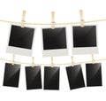 Photo frames hanging on clothesline with clothespins on white