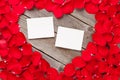 Photo frames over wood and red rose petals Royalty Free Stock Photo