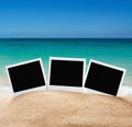 Photo frames on the sea sand on the beach Royalty Free Stock Photo