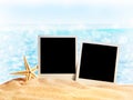Photo frames on the sea sand Royalty Free Stock Photo