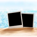 Photo frames on the sea sand Royalty Free Stock Photo