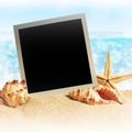 Photo frames on the sea sand Royalty Free Stock Photo