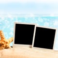 Photo frames on the sea sand Royalty Free Stock Photo