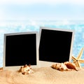 Photo frames on the sea sand Royalty Free Stock Photo