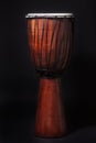 African Djambe drums on a black background.