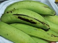 Photo of fresh green bananas in plastic bag. Royalty Free Stock Photo