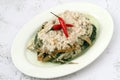 Freshly cooked Filipino dish called Spicy Pinangat Bicol or dried fish, pork, shrimp paste and gabi leaves