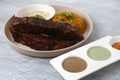 Freshly cooked pork baby back ribs served with gravy and fried rice Royalty Free Stock Photo