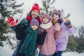 Photo of friendly cute husband wife small kids wear windbreakers waving arms hi you together outside urban city park Royalty Free Stock Photo